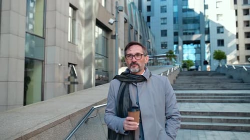 Middle aged business man going to work at his office.
