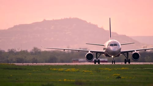 Huge Airplane Jet Maneuvering After Landing at International Airport Landing Zone at Beautiful