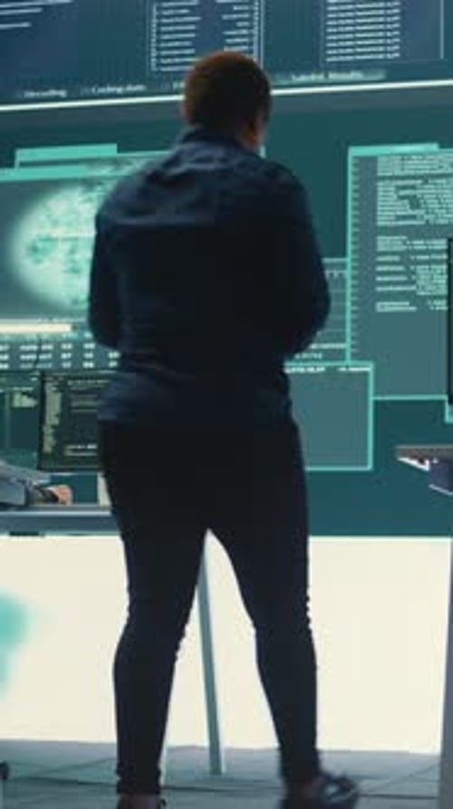 Computer Expert Working in Dark Office at Night