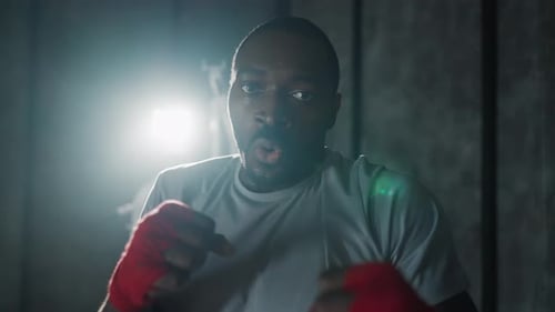 Portrait Aggressive Man Boxer in Gym African American Sportive Focused Sweated Fighter During Boxing