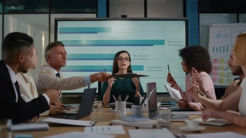 Top Manager Discussing Business Strategy With Team Members In Office. Multi Ethnic Colleagues Tal...