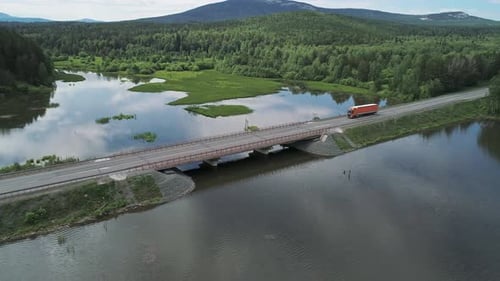 Aerial View of Small Road Bridge Across the River in Rural Area Lorry is Driving on the Bridge Sky
