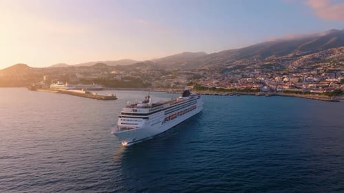 Explore stunning ocean views aboard a cruise ship near lush coastal city