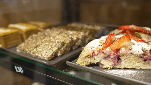 Delicious Pastries and Cakes Displayed in Bakery Window