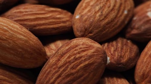 Closeup view of raw salted almonds.