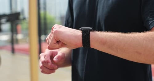 Close Up Man Checking Results on Smartwatch After Training Healthy Lifestyle Concept