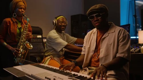 Three African American Jazz Musicians Recording New Music in Studio