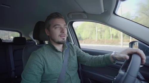 man driving a car and looking in mirror glasses with different expressions