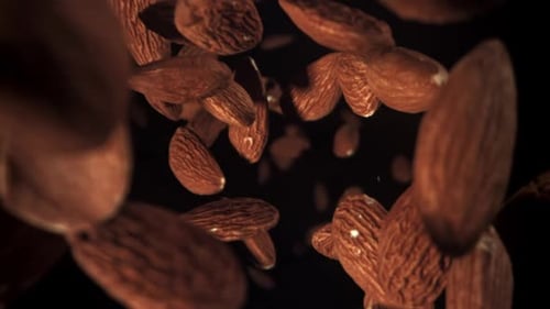 Almonds Floating on Black Background