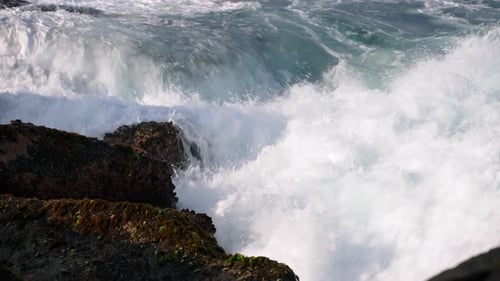 Waves Crashing on Rocky Shoreline