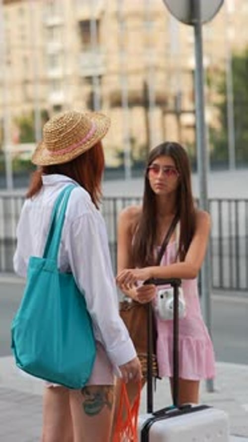 Young Women Talking in Urban Setting