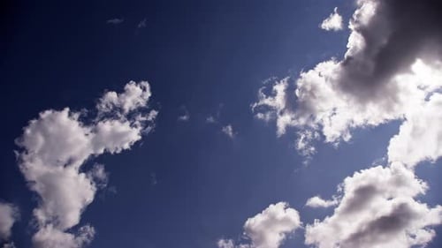 Watching White Clouds Drift In The Blue Sky