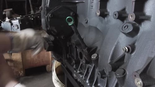 Mechanic Working on Large Engine