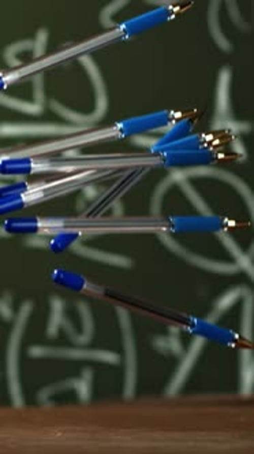 Pens Fall on the School Desk Filmed on a Highspeed Camera at 1000 Fps