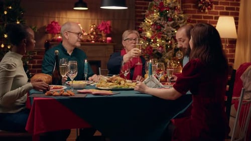 Friends Celebrating Christmas Dinner With Champagne Toast
