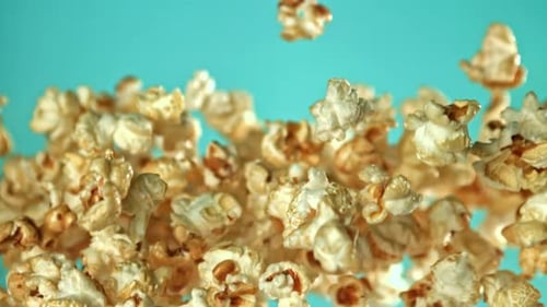 Popcorn Floating in the Air Against Blue Background