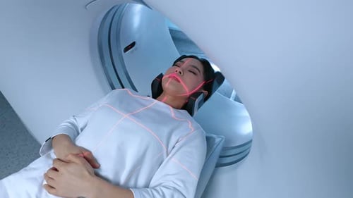 Woman Undergoes Medical Scan in Modern Hospital Equipment
