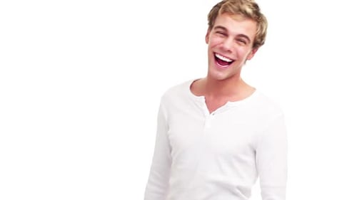 4k video footage of a young man giving the thumbs up against a studio background