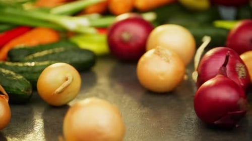 Fresh Vegetables and Onions on a Table