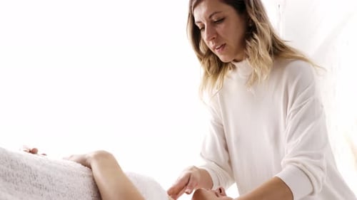 Woman Receiving Relaxing Head and Neck Massage