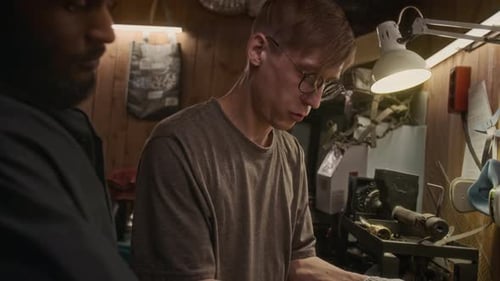 Multiethnic Male Technicians Assembling Metal Item with Wrench in Workshop