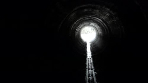 Moving Through Dark Tunnel Toward Bright Light