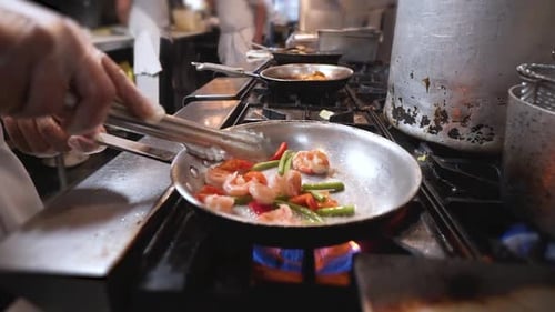 Cooking Shrimp and Peppers in Restaurant Kitchen