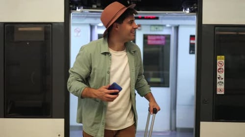 Smiling Young Adult at Train With Luggage