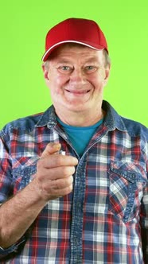 Man Lights Lighter in Front of Green Screen