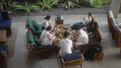 Group of Friends Enjoying a Casual Meal and Conversation in Cafe