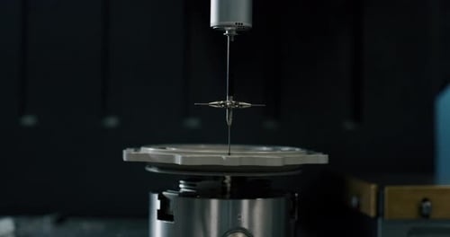 Slow motion macro of specialist is working on production of different gearing details in a worksho