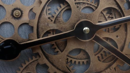 Clockwork movement of a clock shows wheels with gears and cogs