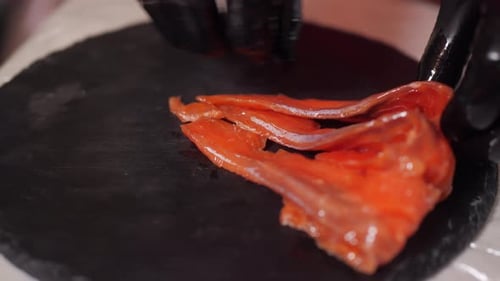 Arranging Raw Salmon Slices