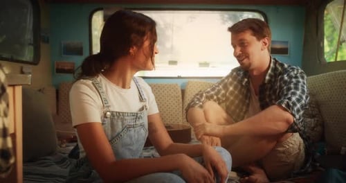 Couple Laughing and Talking in Camper