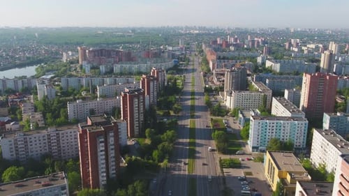 Aerial View of the Urban Landscape Showcasing Residential Buildings and Busy Roadways