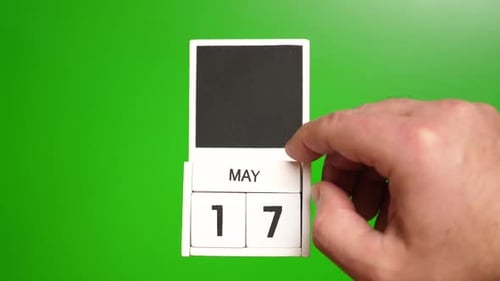 05. Calendar with the date of May 17 on a green background. Illustration for an event of a certain d