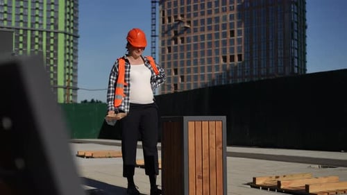 Pregnant Woman Construction Worker Inspects Building Site