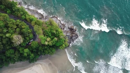 Aerial view Drone camera of seashore rocks and traffic road.