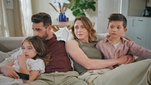 Relaxed Parents Kids Embracing at Cozy Couch Closeup Funny Children Having Fun