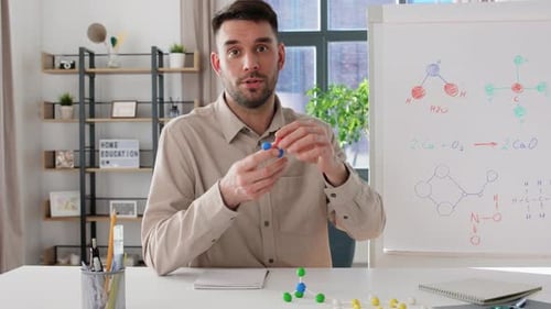 Distance Education School and Video Blogging Concept - Male Chemistry Teacher With