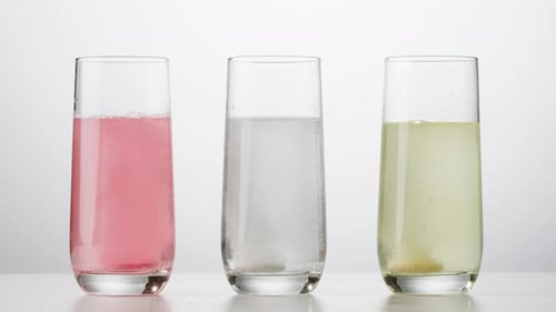 Effervescent Tablets Dissolving in Glasses of Water