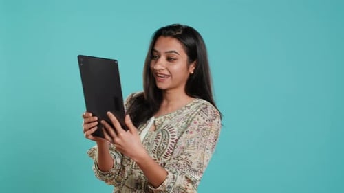 Woman Video Chatting on Tablet, Bright Background