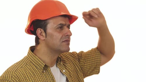 Disappointed Hispanic Builder in Hardhat Expressing Frustration