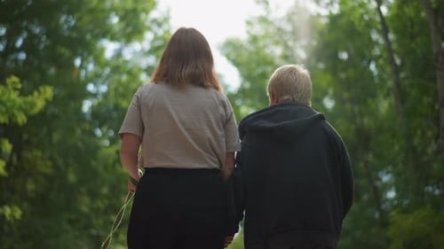 Tranquil Forest Path Shared By Mother And Child During Afternoon Supportive Journey Through Forest