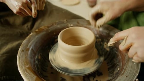 Pottery workshop a potter works with a potter's wheel a product made of clay a potter conducts