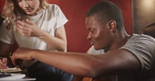 Musicians Composing Music in Studio