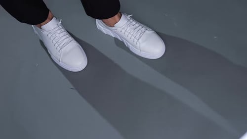 Stylish White Sneakers and Black Dress Pants