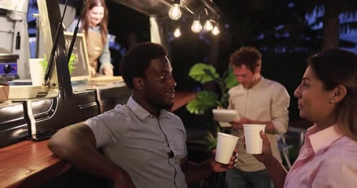 Multiracial People Talking Together In Front Of Food Truck Outdoor - Multigeneratiol Friends Hav...