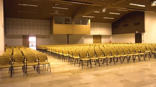 Spacious Seminar Hall with Organized Chairs and Elegant Design