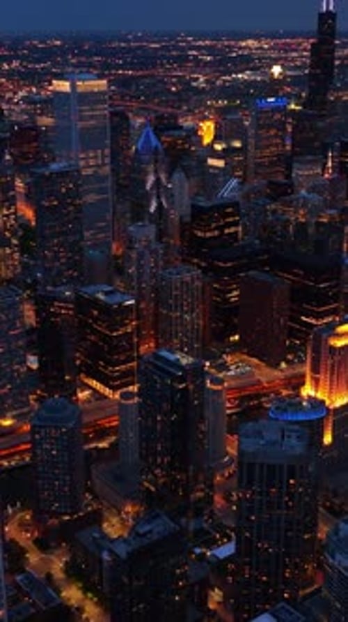 Eye-catching view of Chicago downtown in the evening. Stunning metropolis in lights from view above